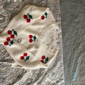 It’s a white cherry crop sweater